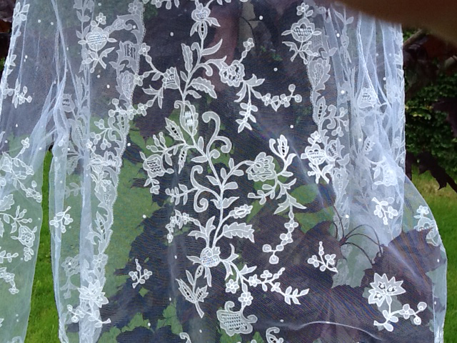 Close up of a veil with carrickmacross lace